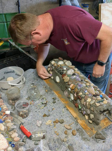 HRD Employee Decorating a column